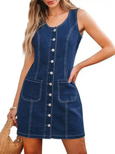 A navy blue sleeveless denim dress with button-front closure and two front pockets is a stylish denim dress