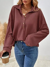 Rust-colored button-front waffle knit polo sweatshirt with collar made from ribbed fabric, machine wash cold