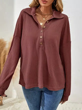 Rust-colored button-front waffle knit polo sweatshirt with ribbed collar machine wash cold for easy care