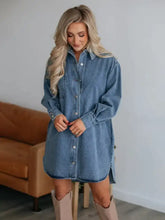Women’s medium-wash denim dress with collared neck long sleeve and button-front closure in a casual style