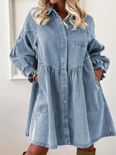 Light blue denim shirt dress with puff sleeves and smocked cuffs in a button-up denim shirt style