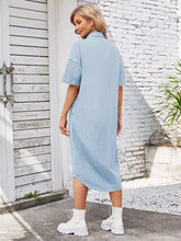 Light blue denim dress with short sleeves and a collar featuring a dropped shoulder design for casual wear