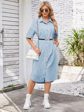 Light blue denim button up dropped shoulder dress with black belt gold buckle and front pockets