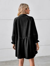 Black denim dress with button up front long flounce sleeves and relaxed fit mini denim dress style