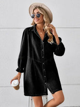 Black denim dress featuring button front and ruffled sleeves in a mini denim dress style