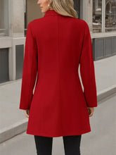 A vibrant red button up long sleeve coat with a classic collar and tailored fit for stylish outerwear