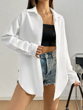 White oversized button up long sleeve shirt with classic collar made from breathable cotton fabric for casual wear