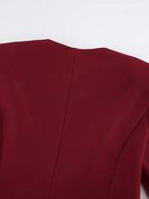 Back view of deep red Button Up Peplum Blazer & Skirt Set with sleek fabric and subtle seams