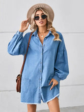 Blue denim dress with button front pocketed raw hem and frayed hem detail in lightweight denim fabric