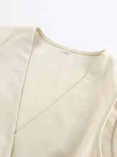 Button up vest and shorts set: beige canvas wrap-style top with textured fabric