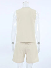 Button up beige sleeveless vest and matching shorts set on mannequin