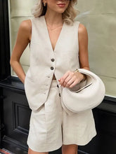 Cream linen sleeveless vest with dark buttons and matching shorts set
