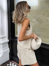 Cream-colored structured handbag with rounded silhouette in Button Up Vest and Shorts Set