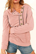 Women’s buttoned long sleeve hoodie in dusty pink with exposed stitching