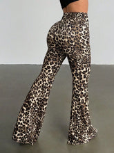 Leopard print high waist flare pants in black and beige with a bold pattern made from stretchy fabric