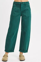 Emerald green high rise ankle cuffed wide-leg trousers with rolled cuffs and front pockets from risen collection