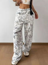Silver metallic abstract print wide leg pants featuring a leafy pattern machine wash cold recommended