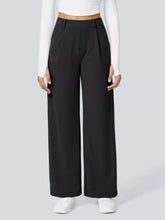 Black high-waisted wide-leg pants with a sleek tailored design suitable for machine wash cold care