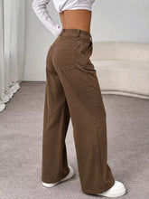 Brown wide-leg casual pants with a relaxed fit and classic front pockets designed for comfort and style