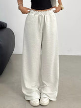 Wide leg drawstring sweatpants in light gray with elastic cuffs and drawstring waistband for comfortable wear