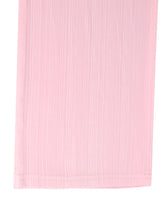 A delicate pink pleated fabric panel with fine vertical folds on tied wide leg pants for an elegant look