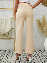 Beige high waist flare pants with wide-leg cut made of smooth slightly glossy fabric and tailored seams