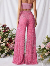 Pink sequin embellished wide leg pants featuring high waist and wide leg design in sparkling fabric