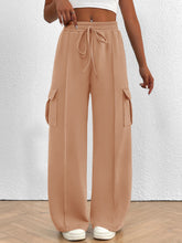 Beige casual high waist cargo pants with elastic waistband, drawstring, and large side pockets for everyday wear