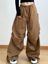 Brown wide leg casual drawstring pants with loose fit, side pockets, and adjustable waist for perfect fit comfort