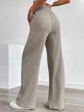 Beige texture wide leg pants with crinkled fabric and elastic waistband in a wide leg pants design