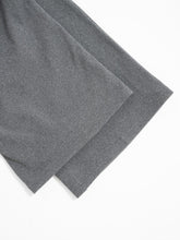 Gray textured soft knit fabric of relaxed fit drawstring pants showcasing comfortable fit drawstring pants material