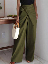 Olive green wrap waist wide leg pants featuring a draped waistband for a stylish and comfortable fit