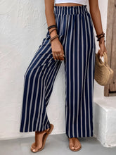 Navy blue and white striped wide leg pants with elastic waistband designed for comfort and easy care instructions