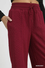 Burgundy umgee cable knit textured wide leg pants with elastic waistband and drawstring detail