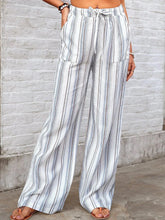 Full size striped wide leg pants in white and gray with drawstring waistband and wide leg design for plus size wear