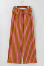 Pink and orange vertically striped wide leg pants with button pocket tie waistband for casual wear