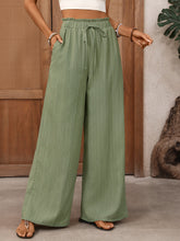 Mint green wide leg drawstring waist pants with scalloped hem for a stylish and comfortable wide leg look