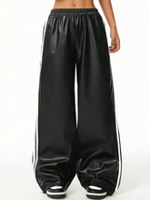Black satin wide-leg pants with white striped side panels ideal for casual wear and tumble dry care