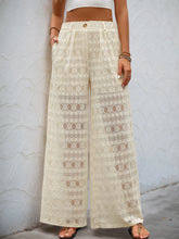 Cream-colored lace wide leg pants with geometric pattern and decorative button wide closure