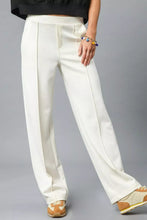 Cream-colored umgee high waisted wide-leg pants with tailored fit and subtle front pleats for a sleek look