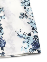 Delicate white fabric wide leg pants with soft blue and black floral print tie featuring intricate blossoms and leaves