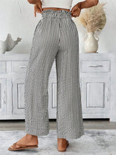 Full size plus size paper bag waist wide leg trousers in black and white vertical stripes with lightweight fabric