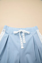 Light blue wide leg pleated pants with lace accent floral trim and matching lace drawstring waist for slouchy fit
