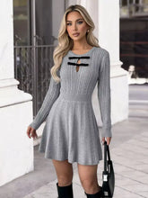 Cable knit A-line sweater dress in gray with black lace-up neckline