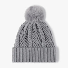 Gray cable knit solid color hat with faux fur pom-pom