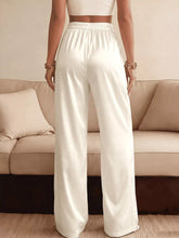 White satin wide-leg pants with an elastic lace waist detail and comfortable fit for elegant wear
