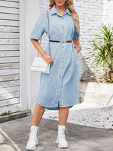 Light blue half sleeve denim dress with button down front and black belt with silver buckle for casual wear