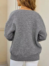 Gray heathered earth tone knit cardigan with relaxed fit, ribbed cuffs, slightly stretchy