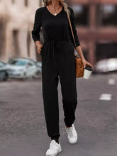 Black long-sleeved v-neck jumpsuit, drawstring waist, machine wash cold