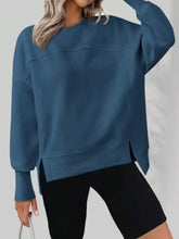 A teal casual loose side slit sweatshirt with oversized fit designed for comfort and machine wash cold care